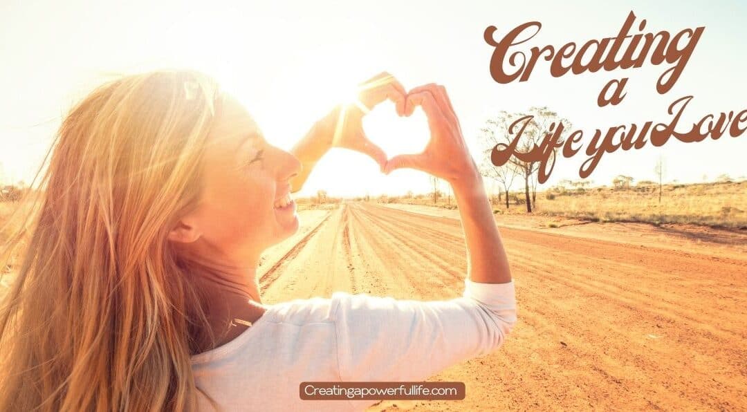 Woman Making a heart shape with her hands to show love